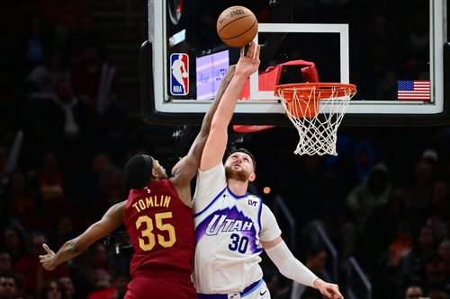 Jan 12, 2026; Cleveland, Ohio, USA; Utah Jazz center Jusuf Nurkic (30) blocks the shot of Cleveland Cavaliers forward Nae'qwan Tomlin (35) during the second half at Rocket Arena. Mandatory Credit: Ken Blaze-Imagn Images