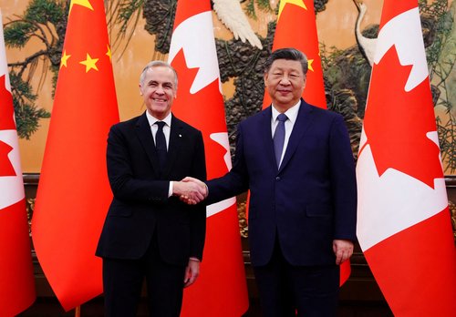 Canadian Prime Minister Mark Carney shakes hands with President of China Xi Jinping