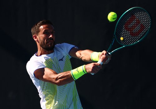 Tennis - Australian Open - Melbourne Park, Melbourne, Australia - January 18, 2026 Bosnia and Herzegovina's Damir Dzumhur in action during his first round match against Canada's Liam Draxl REUTERS/Tingshu Wang