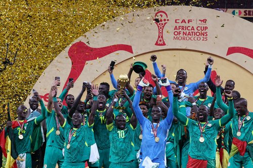 Soccer Football - CAF Africa Cup of Nations - Morocco 2025 - Final - Senegal v Morocco - Prince Moulay Abdellah Stadium, Rabat, Morocco - January 18, 2026 Senegal's Sadio Mane lifts the trophy with teammates as they celebrate after winning the Africa Cup