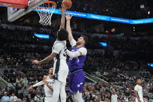 Jan 19, 2026; San Antonio, Texas, USA; Utah Jazz center Jusuf Nurkic (30) shoots over San Antonio Spurs forward Julian Champagnie (30) in the first half at Frost Bank Center. Mandatory Credit: Daniel Dunn-Imagn Images