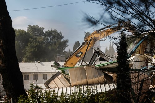 Heavy machinery operates as Israeli forces dismantle the Jerusalem headquarters of the United Nations Relief and Works Agency for Palestine Refugees (UNRWA), in East Jerusalem, January 20, 2026. REUTERS/Ammar Awad
