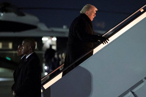 U.S. President Donald Trump boards Air Force One for travel to the World Economic Forum in Davos, Switzerland, from Joint Base Andrews, Maryland, U.S., January 20, 2026. REUTERS/Jonathan Ernst