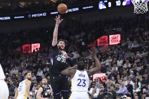 Jan 28, 2026; Salt Lake City, Utah, USA; Utah Jazz center Jusuf Nurkic (30) shoots over Golden State Warriors forward Draymond Green (23) during the first half at Delta Center. Mandatory Credit: Rob Gray-Imagn Images