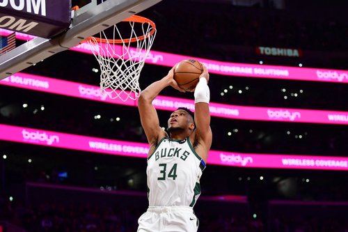 Jan 9, 2026; Los Angeles, California, USA; Milwaukee Bucks forward Giannis Antetokounmpo (34) dunks for the basket against the Los Angeles Lakers during the first half at Crypto.com Arena. Mandatory Credit: Gary A. Vasquez-Imagn Images