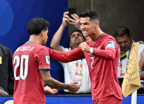Soccer Football - FIFA World Cup 2026 - Group K - Portugal v Uzbekistan - Houston Stadium, Houston, Texas, U.S. - June 23, 2026 Portugal's Cristiano Ronaldo celebrates scoring their third goal with Joao Cancelo IMAGN IMAGES via Reuters/Maria Lysaker