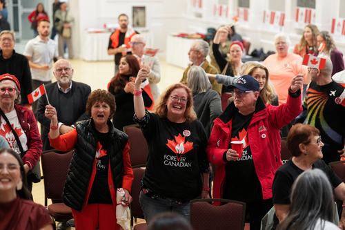Supporters of the Forever Canadian group, who want Alberta to remain in Canada, react on the day of a non-binding referendum on Alberta sovereignty in Edmonton, Alberta, Canada October 19, 2026. REUTERS/Todd Korol