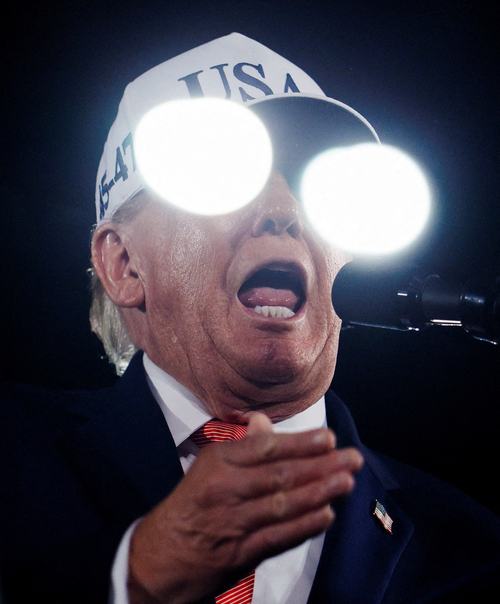 US President Donald Trump speaks as lights are reflected off a bulletproof screen during a campaign rally at Pitt-Greenville Airport in Greenville, North Carolina, US, October 20, 2026. REUTERS/Evan Vucci TPX IMAGES OF THE DAY