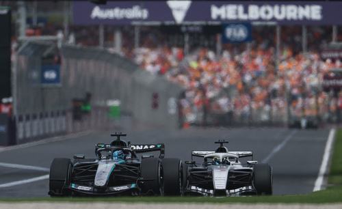 Formula One F1 - Australian Grand Prix - Albert Park Grand Prix Circuit, Melbourne, Australia - March 8, 2026 Mercedes' George Russell and Cadillac's Sergio Perez in action during the race REUTERS/Hollie Adams
