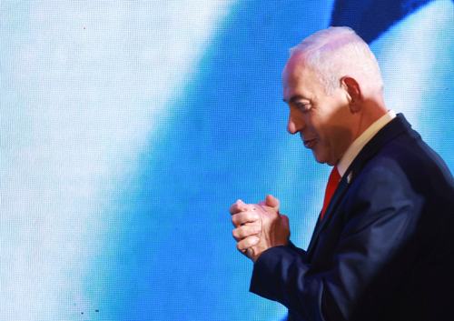 Israeli Prime Minister and Likud party leader Benjamin Netanyahu gestures as he walks on the stage ahead of speaking after exit polls, at his party headquarters during Israel's national election, in Jerusalem, October 28, 2026. REUTERS/Ronen Zvulun