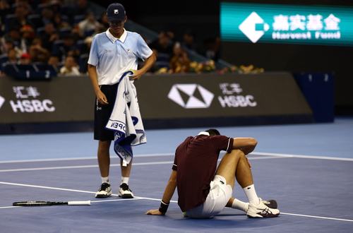 Tennis - China Open - National Tennis Center, Beijing, China - October 5, 2026 Serbia's Novak Djokovic after falling during his semi final match against Russia's Daniil Medvedev REUTERS/Tingshu Wang