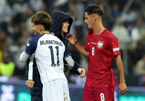 Soccer Football - Nations League - Group B4 - Bosnia and Herzegovina v Poland - Stadion Bilino Polje, Zenica, Bosnia and Herzegovina - October 5, 2026 Bosnia and Herzegovina's Esmir Bajraktarevic shakes hands with Poland's Kacper Urbanski after the match