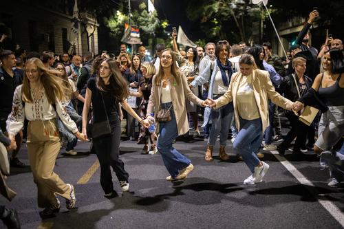 People take part in a student-led protest over diaspora voting arrangements in front of the Republic Election Commission in Belgrade