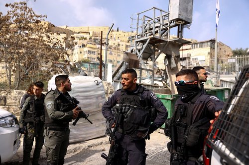 Israeli security personnel work near a scene where a suspected incident of shooting attack took place, police spokesman said, just outside Jerusalem's Old City