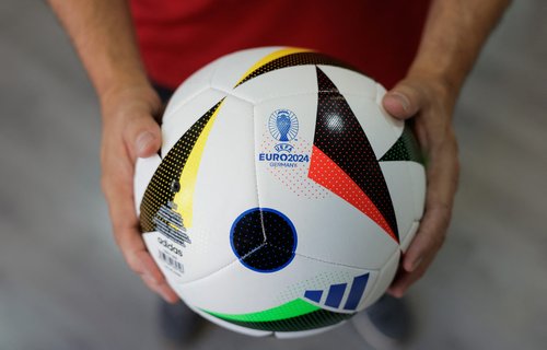 Adidas balls printed as the Euro 2024 match ball 'Fussballliebe' are displayed in Intersport Cary sports clothing store, in Ronda