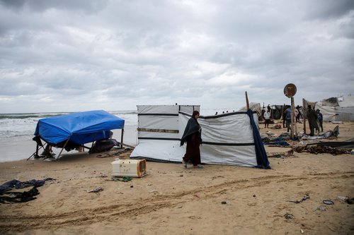 Heavy rains and rising sea levels flood the tents of displaced Palestinians in Gaza's Khan Younis