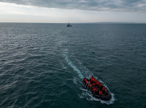 FILE PHOTO: Migrants cross the English Channel in small boats