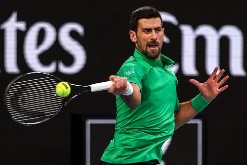 Serbia's Novak Djokovic hits a return to Spain's Carlos Alcaraz during their men's