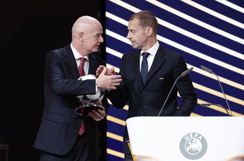 Soccer Football - 50th Ordinary UEFA Congress - Brussels Expo, Brussels, Belgium - February 12, 2026 UEFA president Aleksander Ceferin and FIFA president Gianni Infantino shake hands during the event REUTERS/Benoit Tessier