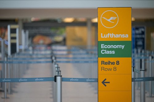 FILE PHOTO: A sign with a logo of Lufthansa stands at Hamburg airport in Hamburg, Germany March 9, 2025. REUTERS/Fabian Bimmer/File Photo