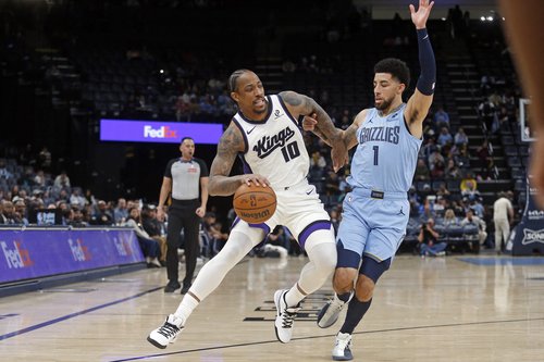 Feb 23, 2026; Memphis, Tennessee, USA; Sacramento Kings guard DeMar DeRozan (10) drives to the basket as Memphis Grizzlies guard Scotty Pippen Jr. (1) defends during the first quarter at FedExForum. Mandatory Credit: Petre Thomas-Imagn Images