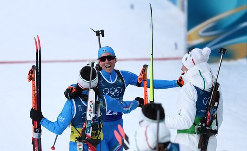 Milano Cortina 2026 Olympics - Biathlon - Mixed Relay 4 x 6km (M+W) - Anterselva Biathlon Arena, South Tyrol, Italy - February 08, 2026. Lisa Vittozzi of Italy celebrates with Dorothea Wierer, Lukas Hofer and Tommaso Giacomel after winning the silver med