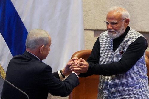 Israel's Prime Minister Benjamin Netanyahu greets India's Prime Minister