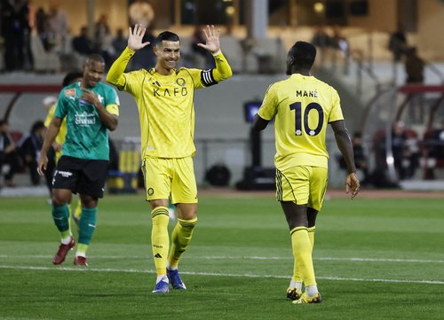 Soccer Football - Saudi Pro League - Al Najma v Al Nassr - King Abdullah Sport City Stadium, Jeddah, Saudi Arabia - February 25, 2026 Al Nassr's Sadio Mane celebrates scoring their fourth goal with Cristiano Ronaldo REUTERS/Hamad I Mohammed