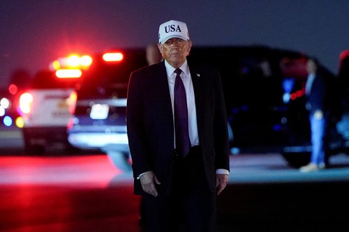 U.S. President Donald Trump looks on after disembarking Air Force One at Palm Beach International Airport in West Palm Beach, Florida, U.S., February 27, 2026. REUTERS/Elizabeth Frantz TPX IMAGES OF THE DAY