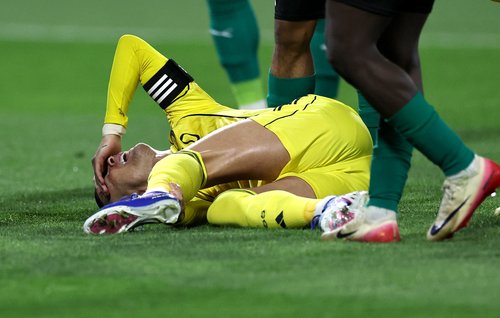 Soccer Football - Saudi Pro League - Al Najma v Al Nassr - King Abdullah Sport City Stadium, Jeddah, Saudi Arabia - February 25, 2026 Al Nassr's Cristiano Ronaldo reacts after sustaining an injury REUTERS/Hamad I Mohammed