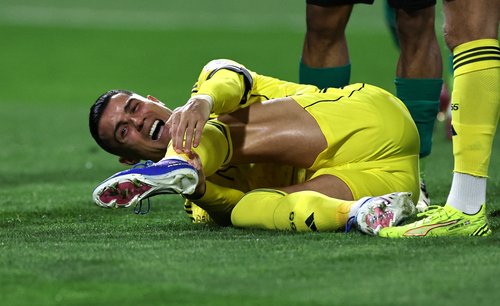 Soccer Football - Saudi Pro League - Al Najma v Al Nassr - King Abdullah Sport City Stadium, Jeddah, Saudi Arabia - February 25, 2026 Al Nassr's Cristiano Ronaldo reacts after sustaining an injury REUTERS/Hamad I Mohammed