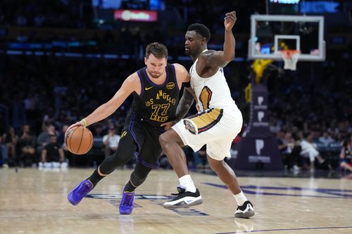 Mar 3, 2026; Los Angeles, California, USA; Los Angeles Lakers guard Luka Doncic (77) dribbles the ball against New Orleans Pelicans guard Saddiq Bey (41) in the second half at Crypto.com Arena. Mandatory Credit: Kirby Lee-Imagn Images