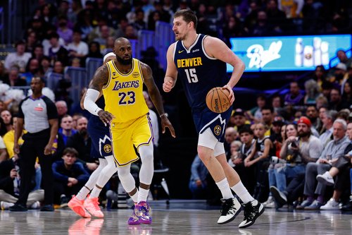 Mar 5, 2026; Denver, Colorado, USA; Denver Nuggets center Nikola Jokic (15) controls the ball as Los Angeles Lakers forward LeBron James (23) guards in the fourth quarter at Ball Arena. Mandatory Credit: Isaiah J. Downing-Imagn Images