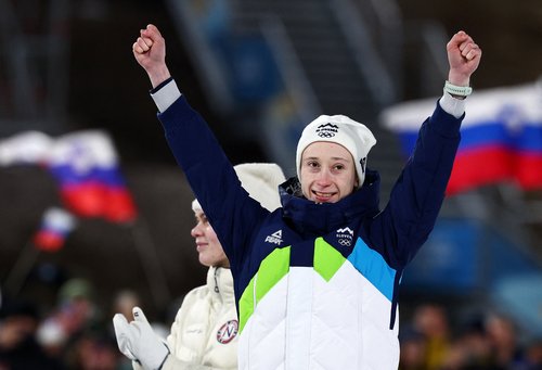 Milano Cortina 2026 Olympics - Ski Jumping - Women's Large Hill Individual Victory Ceremony - Predazzo Ski Jumping Stadium, Predazzo, Italy - February 15, 2026. Bronze medallist Nika Prevc of Slovenia celebrates on the podium after the Women's Large Hill