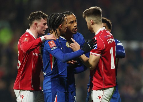 Soccer Football - FA Cup - Fifth Round - Wrexham v Chelsea - SToK Racecourse, Wrexham, Britain - March 7, 2026 Chelsea's Joao Pedro and Chelsea's Malo Gusto clash with Wrexham's George Thomason REUTERS/Phil Noble