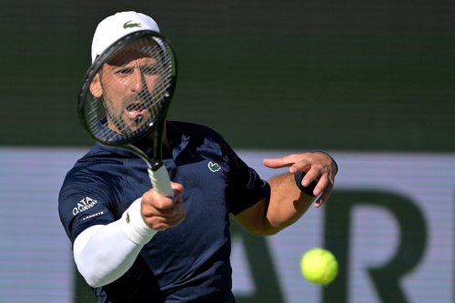 Mar 7, 2026; Indian Wells, CA, USA; Novak Djokovic (SRB) hits a shot during his second round match against Kamil Majchrzak (POL) in the BNP Paribas Open at the Indian Wells Tennis Garden. Mandatory Credit: Jayne Kamin-Oncea-Imagn Images