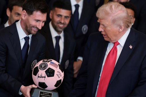 U.S. President Donald Trump is gifted a jewelled soccer ball with his signature on it from Inter Miami CF captain Lionel Messi, on the day he honors reigning Major League Soccer (MLS) champion Inter Miami CF players and team officials with an event in the