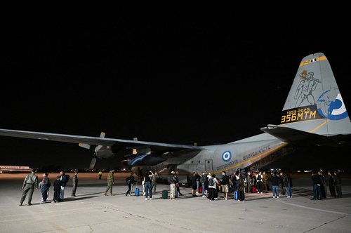 Greek nationals arrive at the Elefsina military airport on a Hellenic Air Force C130