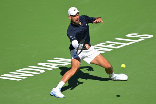 Mar 7, 2026; Indian Wells, CA, USA; Novak Djokovic (SRB) hits a shot during his second round match against Kamil Majchrzak (POL) in the BNP Paribas Open at the Indian Wells Tennis Garden. Mandatory Credit: Jayne Kamin-Oncea-Imagn Images