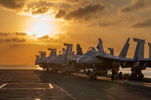 Aircraft are staged for flight operations on the flight deck of the