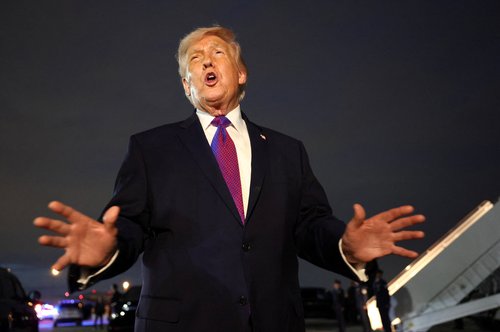U.S. President Donald Trump talks to the media upon his arrival at Joint Base Andrews, Maryland, U.S., March 11, 2026. REUTERS/Kevin Lamarque