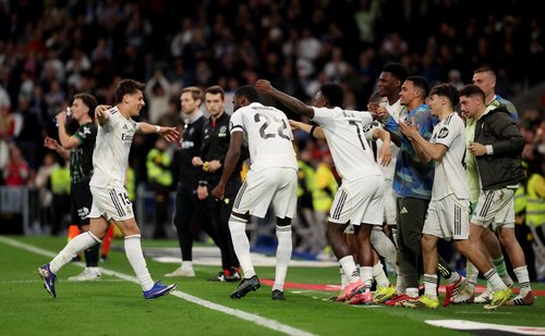 Soccer Football - LaLiga - Real Madrid v Elche - Santiago Bernabeu, Madrid, Spain - March 14, 2026 Real Madrid's Arda Guler celebrates scoring their fourth goal with Antonio Rudiger, Vinicius Junior and teammates REUTERS/Alejandro Martinez Velez