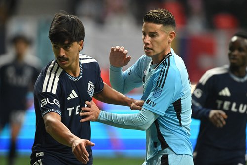 Mar 15, 2026; Vancouver, British Columbia, CAN; Vancouver Whitecaps FC defender Mathías Laborda (2) defends against Minnesota United fC midfielder James Rodriguez (10) during the second half during the second half at BC Place. Mandatory Credit: Anne-Mar