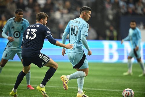 Mar 15, 2026; Vancouver, British Columbia, CAN; Minnesota United fC midfielder James Rodriguez (10) controls the ball against Vancouver Whitecaps FC forward Thomas Muller (13) during the second half at BC Place. Mandatory Credit: Anne-Marie Sorvin-Imagn