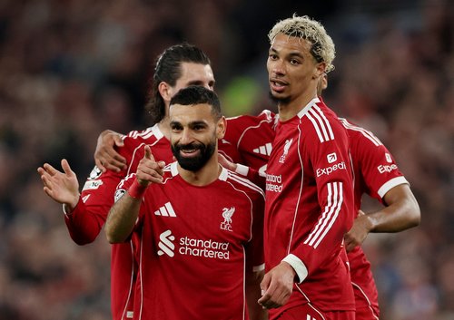 Soccer Football - UEFA Champions League - Round 16 - Second Leg - Liverpool v Galatasaray - Anfield, Liverpool, Britain - March 18, 2026 Liverpool's Mohamed Salah celebrates scoring their fourth goal with Hugo Ekitike REUTERS/Phil Noble