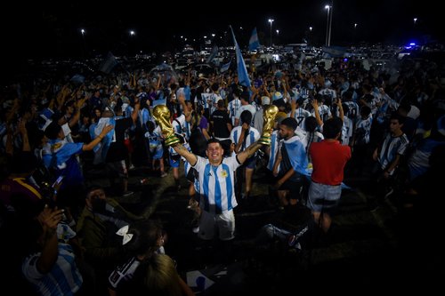 Fans in Buenos Aires celebrate after winning the World Cup