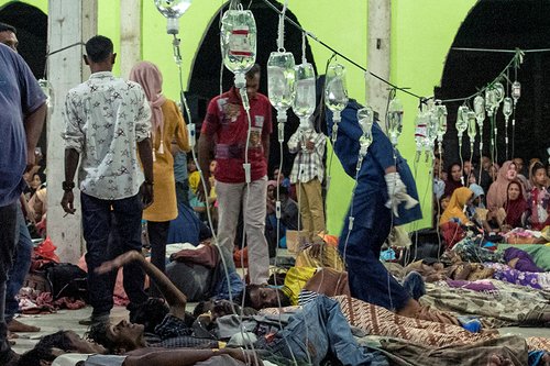 Rohingya refugees receive medical treatment at a temporary shelter in Pidie