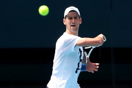 FILE PHOTO: Novak Djokovic practices on court ahead of 2022 Australian Open