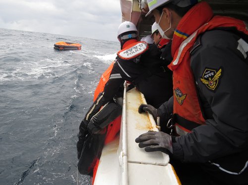 Thirteen crew rescued after ship capsizes off Japan, search on for 9 missing