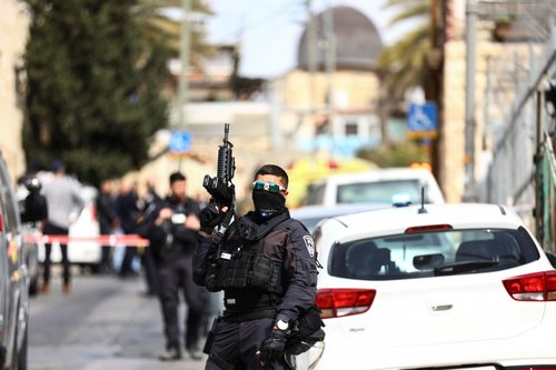 Israeli security personnel work near a scene where a suspected incident of shooting attack took place, police spokesman said, just outside Jerusalem's Old City